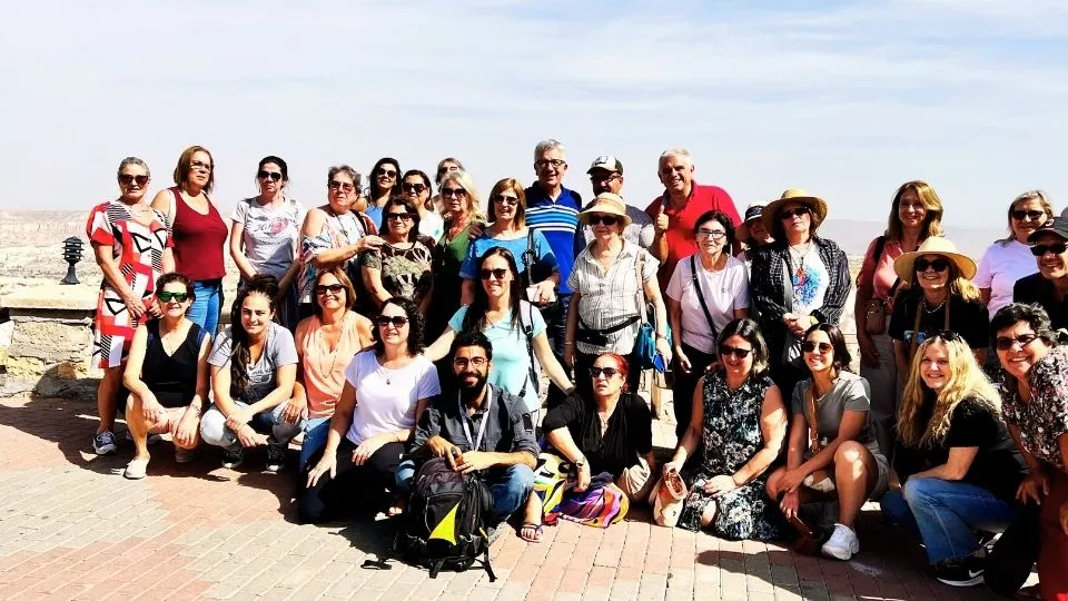 Group of travellers with their licensed guide overlooking the Cappadocia landscape
